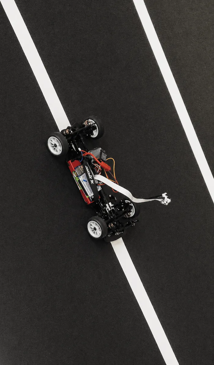 A RC car with a Raspberry Pi 3 and Raspberry Pi Camera mounted on it.
